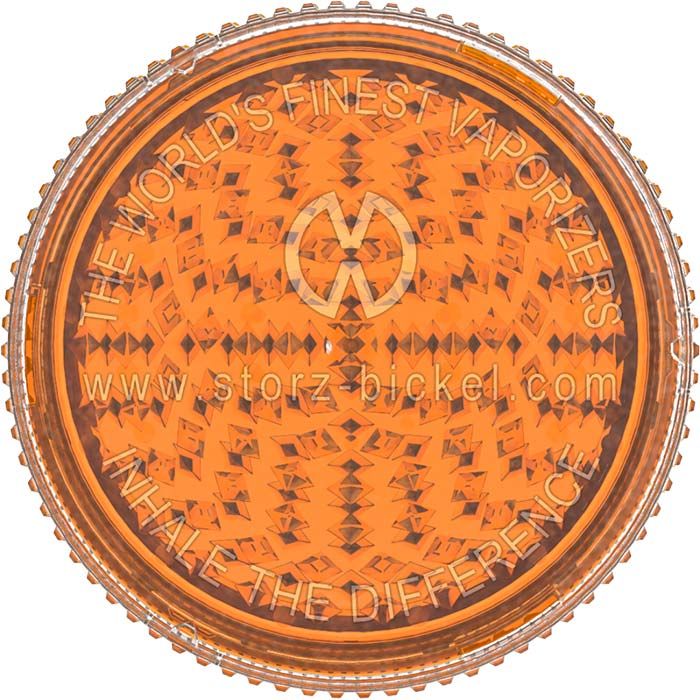 a close up of an orange frisbee in a bowl