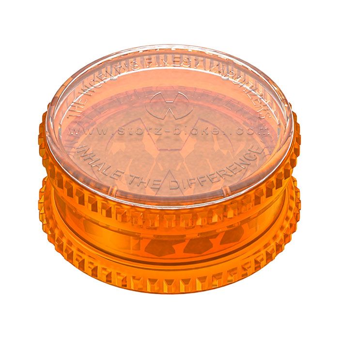 a orange frisbee sitting on top of a table 