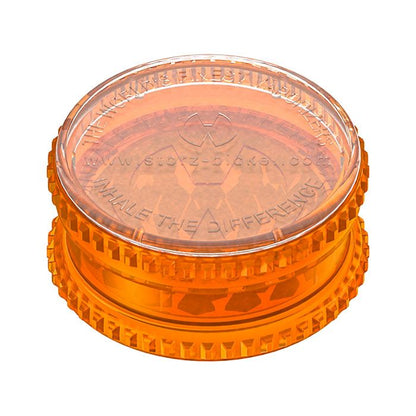 a orange frisbee sitting on top of a table 